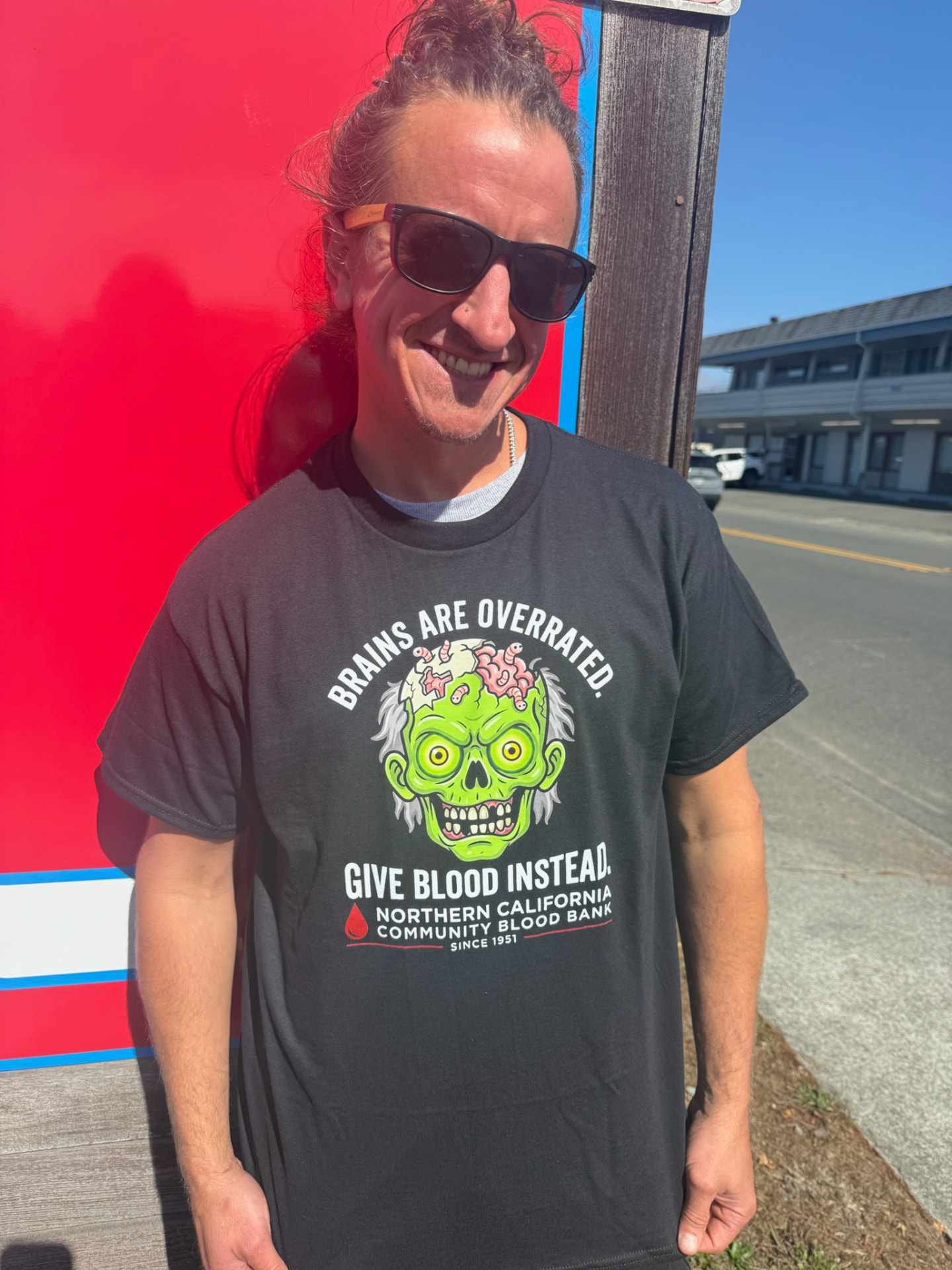 Donor wearing the 2026 special-edition Halloween blood donor shirt