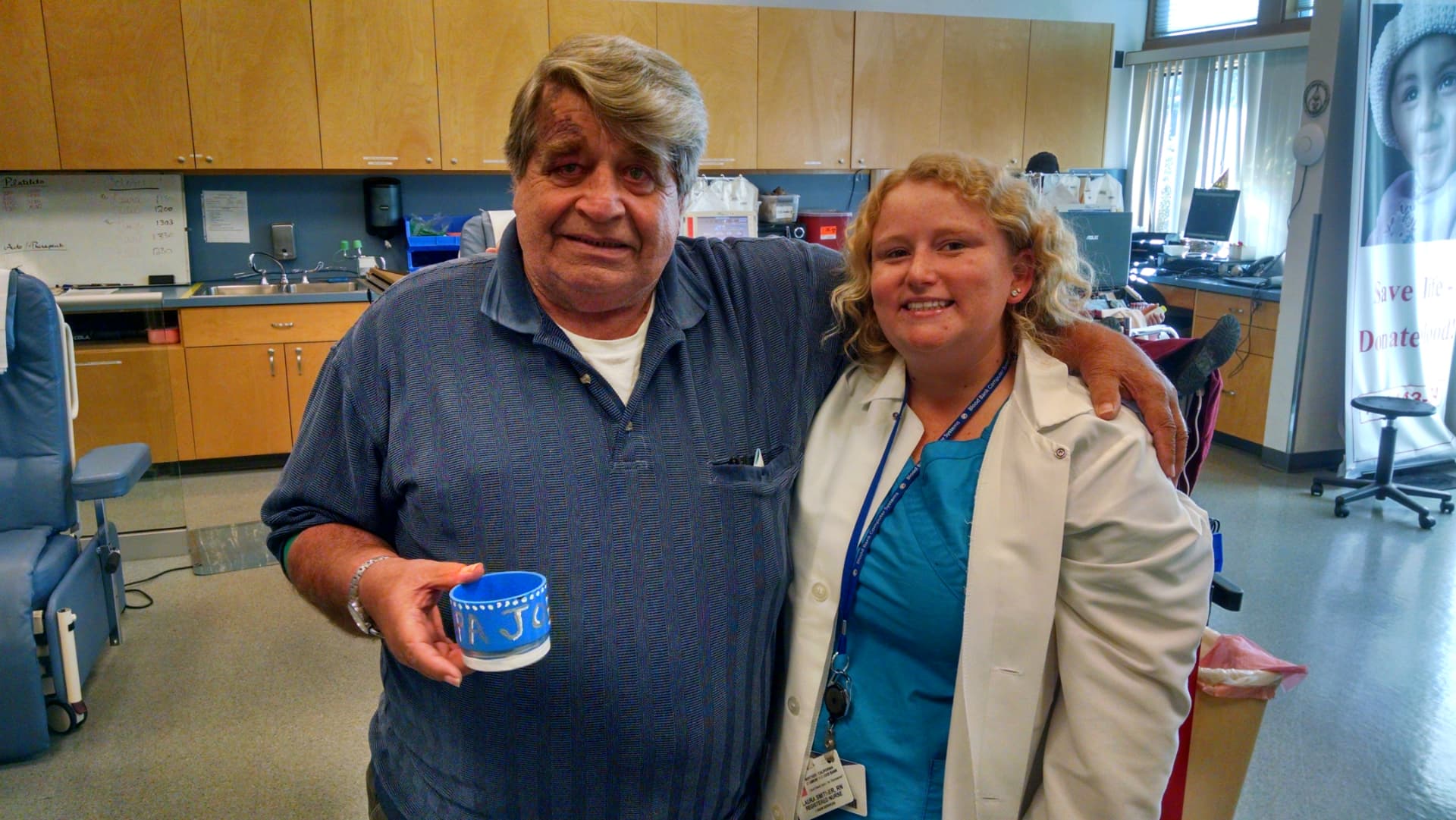 A longtime donor with one of our registered nurses in the donor room