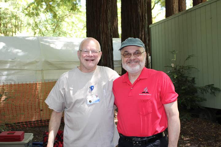 Two donors smiling together in the redwoods